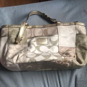 Tan and gold Coach purse. Very good used condition